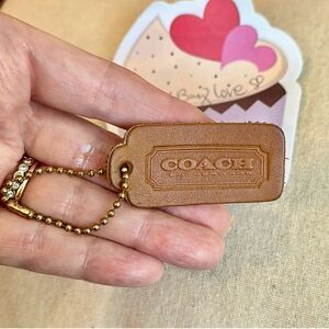 Vintage Coach British Tan leather hangtag with OG “BALL CHAIN” stamped chain.